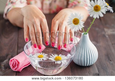 Woman's Hands In Bowl Of Water