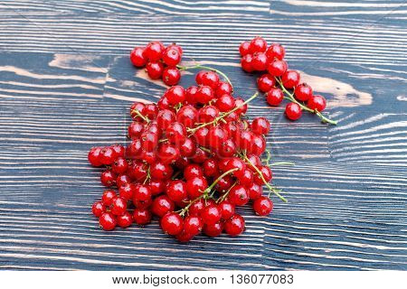 Ripe fresh clusters of red currant on the table