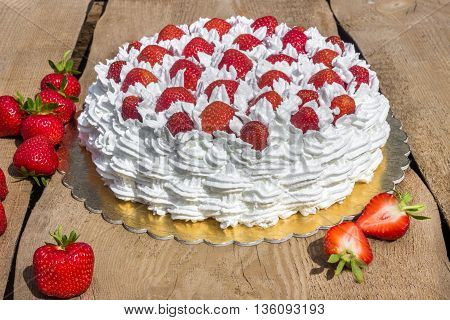 Light, delicate and tasty cream cake with fresh strawberries (half cake)