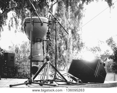 timbales percussion instrument on stage at sunset black and white