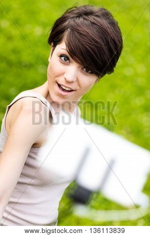 Woman Taking Her Own Portrait With Phone