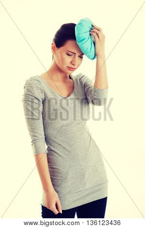 Young beautiful woman is haveng a headache.