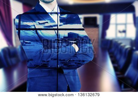 Elegant man in suit on blurred conference room background, double exposition