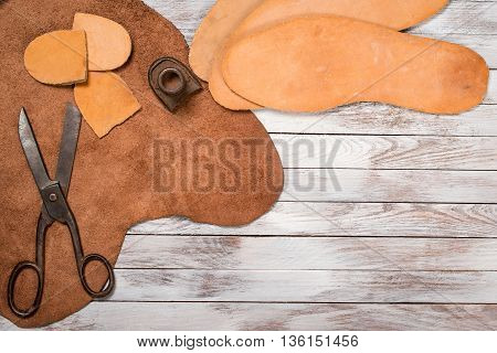 A lot of work tools and leather for shoemaker.Leather craft.