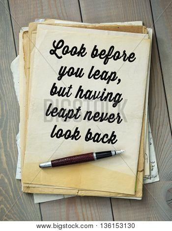 Traditional English proverb.  Look before you leap, but having leapt never look back