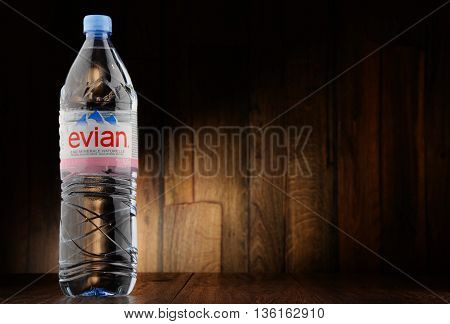 POZNAN POLAND - JUNE 24 2016: Evian is a brand of mineral water made in France on the south shore of Lake Geneva owned by multinational corporation Danone