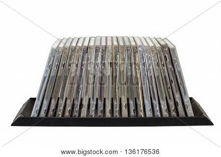 Isolated front view of stacked old grungy compact disk holders on white