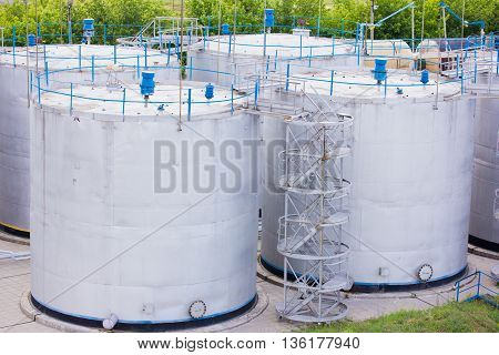 large white tanks for petrol and oil