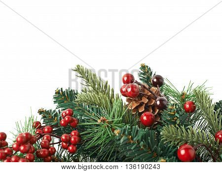 Close-up fragment of a fir Christmas wreath isolated over the white background as a copyspace backdrop composition