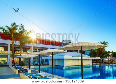modern European resort. the sun. flying the aircraft. pool with bar