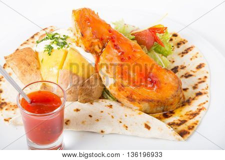 Grilled beef steak served with red spicy sauce