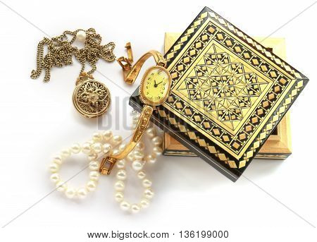 carved wooden box gold jewelry pendant brooch cameo watches pearl strand isolated