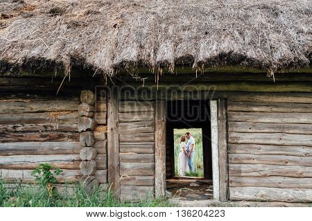 Old wooden house in mountain and river - Ukraine.