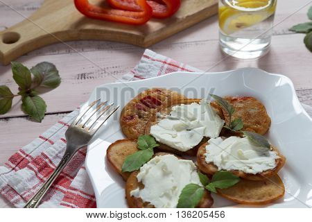 A plate of pancakes with paprika and cream cheese