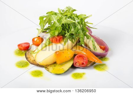 Italian raw arugula salad on a whiteplate