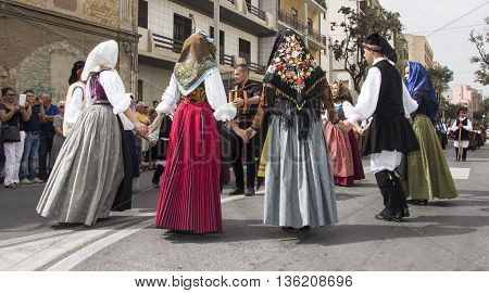 QUARTU S.E., ITALY - September 21, 2014: Parade of Sardinian costumes and floats for the grape festival in honor of the celebration of St. Helena.
