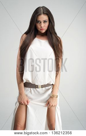 fashion model posing in studio, she wear evening dress