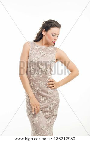 fashion model posing in studio, she wear evening dress