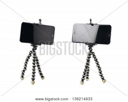 Smartphone set up on a tripod isolated over the white background, set of two different foreshortenings