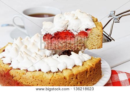 Closeup Piece Of Homemade Sweet Pie With Strawberries And Meringue