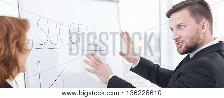 Shot of an ambicious young businessman explaining his business plan