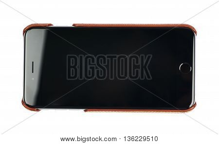 Generic black smartphone in a leather case isolated over the white background
