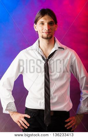 Masculinity fashion party concept. Man in shirt and tie. Young long haired male on bright colorful background.