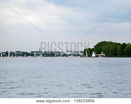 Hamburg Germany - May 25 2008: Hamburg Aussenalster river with view of the skyline of Hamburg city
