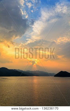 Beautiful landscape during sunset over a mountain ranges at lake in Srinakarin Dam Kanchanaburi Province Thailand