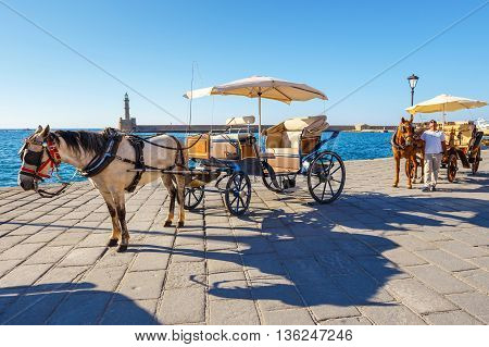 Chania, Crete - 23 Maj, 2016: Horse Carriage For Transporting Tourists In Old Port Of Chania On Cret