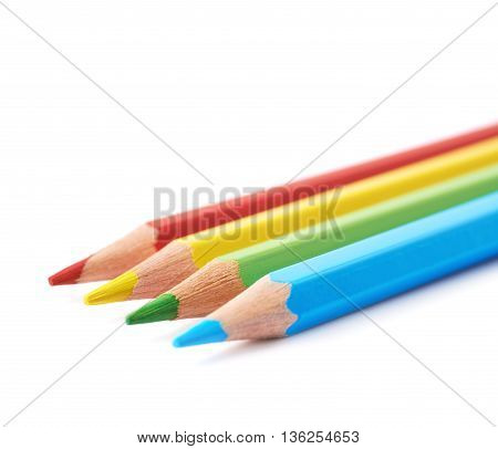 Four colorful drawing pencils composition isolated over the white background, close-up crop fragment