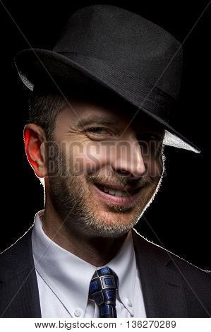 Man wearing a fedora hat as a film noir detective or gangster
