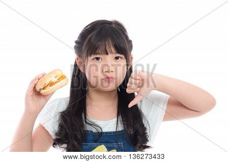 Beautiful asian girl don't like hamburger on white background isolated