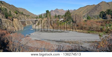 Panoramic view of the Waiau River and Hanmer Bridge in the middle of Winter North Canterbury New Zealand.