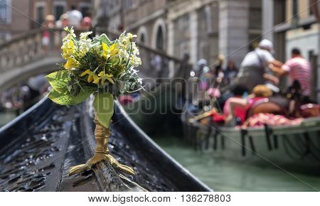 VENICE, ITALY - JUNE 11, 2013:Bouquet of flowers on a boat in Venice