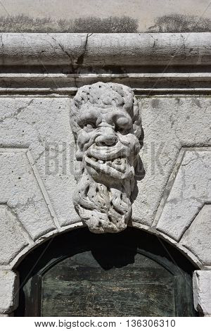 Bizzarre monster guardian head on Santa Formosa bell tower in Venice (17th century)