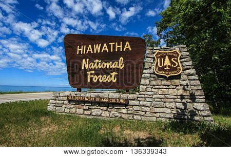 Brevort, Michigan, USA - June 21, 2016: Entrance sign to the Hiawatha National Forest. Hiawatha has coastline on three of the Great Lakes, six lighthouses and thousands of acres of forest.