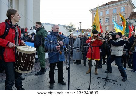 VILNIUS, LITHUANIA - MAR 11: Around one thousand people gathered with flags in a nationalist rally at Rotuses Square on Re-Establishment of Independence Day on March 11, 2014 in Vilnius, Lithuania