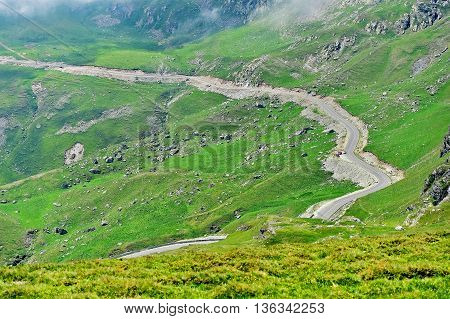 Tranalpina mountain road in Romania in summer with it's highest point Urdele Pass in fog