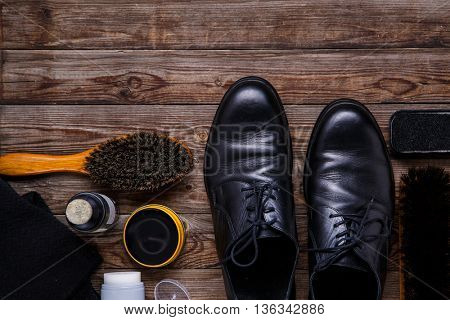 Shoe wax, brush and boot