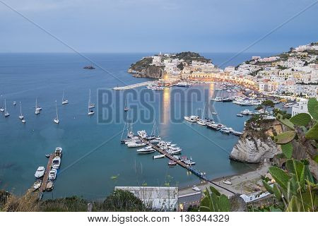 Ponza town scenic view from a hill at blue hour.