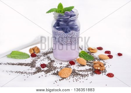 Chia seeds pudding with blueberries, yogurt and fresh strawberries. A healthy and wholesome breakfast or snack.