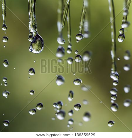 Falling drops in outdoor. Shallow depth of field.