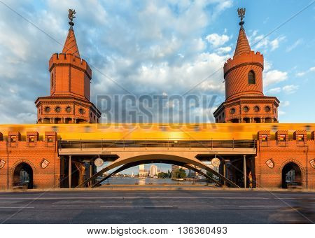 Closeup of the Oberbaum Bridge in Berlin, Germany, with passing by train