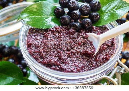 Chokeberry jam and ripe berry of chokeberry