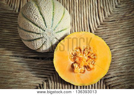 Ripe and juicy melons on natural background
