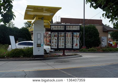 NAPERVILLE, ILLINOIS / UNITED STATES - JULY 23, 2015: Motorists use the drive-through service to purchase food at the McDonald's Restaurant in Naperville.