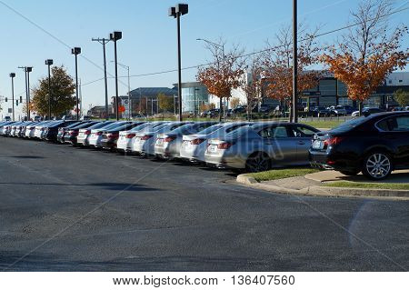 NAPERVILLE, ILLINOIS / UNITED STATES - NOVEMBER 3, 2015: Rows of brand new luxury vehicles are available for purchase on the lot at Lexus of Naperville.