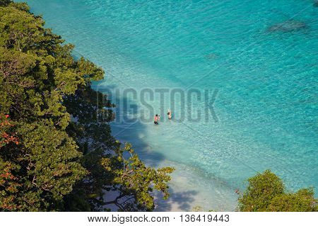 Couple having fun at sunset time Similan Island phu-khet Thailand