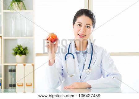 Young Asian Nutritionist Holding An Apple